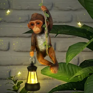 Solar Light Outdoor Statues 7.48'' H Resin Chimpanzee Baby Monkey Climbing On A 19.68" L Vine with LED Lantern Waterproof Hanging Monkey Figurine with Hook for Yard Garden Wall Decoration
